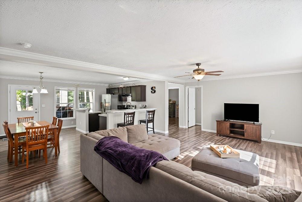 402 Shiloh Road Statesville, NC 28677 - Photo 7 of 34 a living room with furniture and a flat screen tv