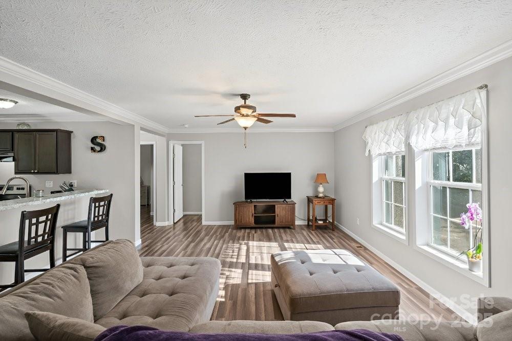402 Shiloh Road Statesville, NC 28677 - Photo 8 of 34 a living room with furniture fireplace and flat screen tv