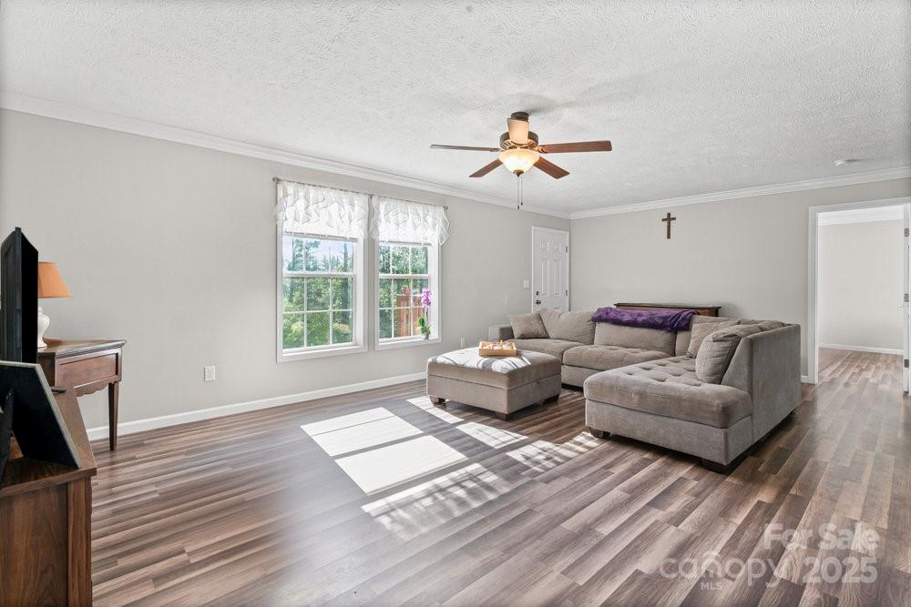 402 Shiloh Road Statesville, NC 28677 - Photo 9 of 34 a living room with furniture and a flat screen tv