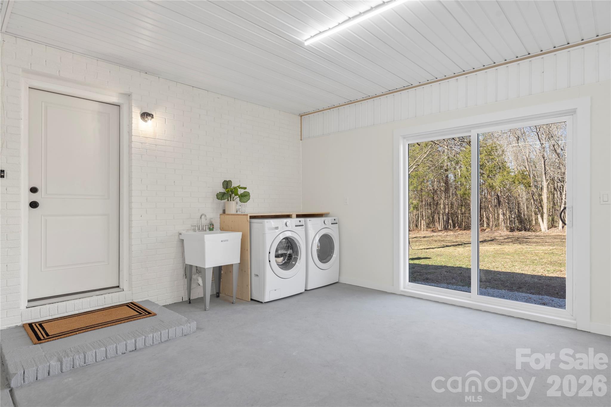 3991 State Rd S-29-330 Lancaster, SC 29720 - Photo 19 of 25 a view of a storage & utility room with washer and dryer