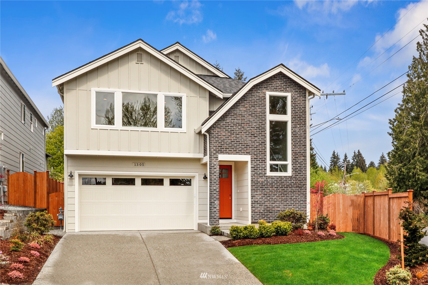 1305 197th Place Southeast Bothell, WA 98012 - Photo 1 of 33 a front view of a house with a yard and trees