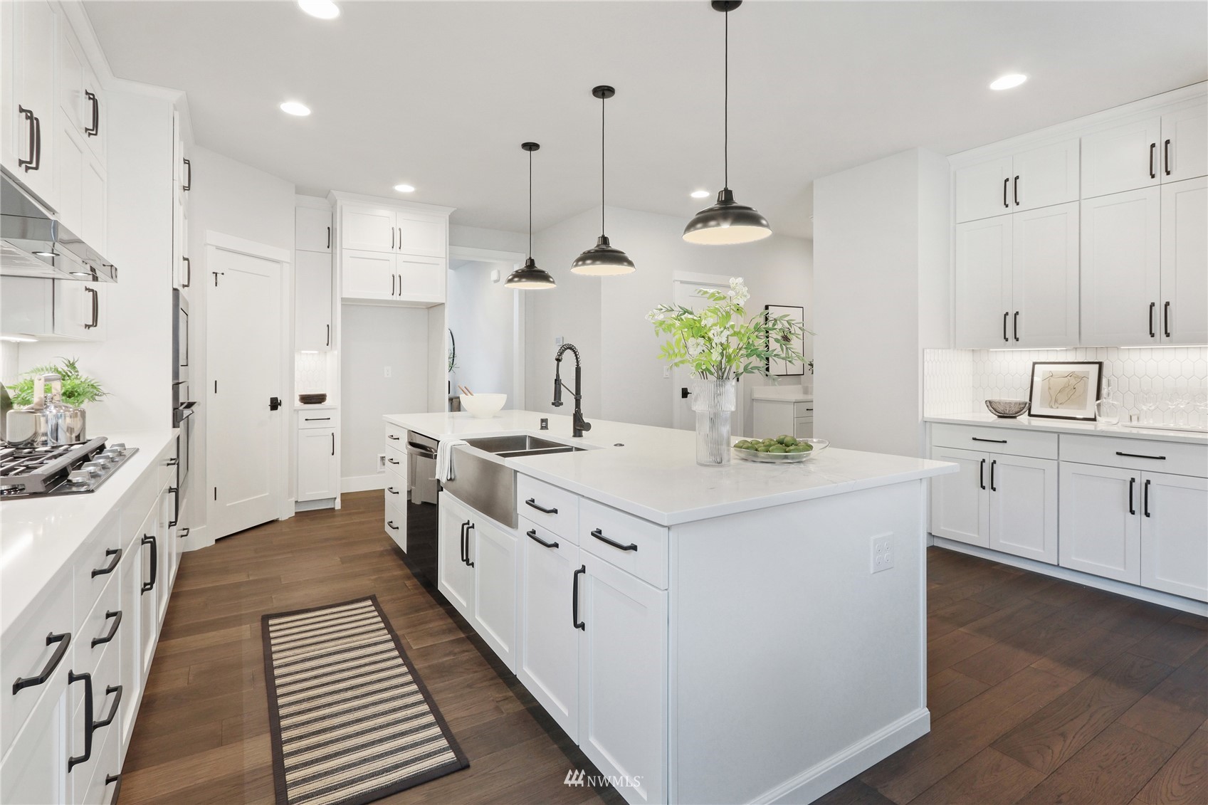 1305 197th Place Southeast Bothell, WA 98012 - Photo 12 of 33 a kitchen with stainless steel appliances kitchen island a refrigerator and a sink