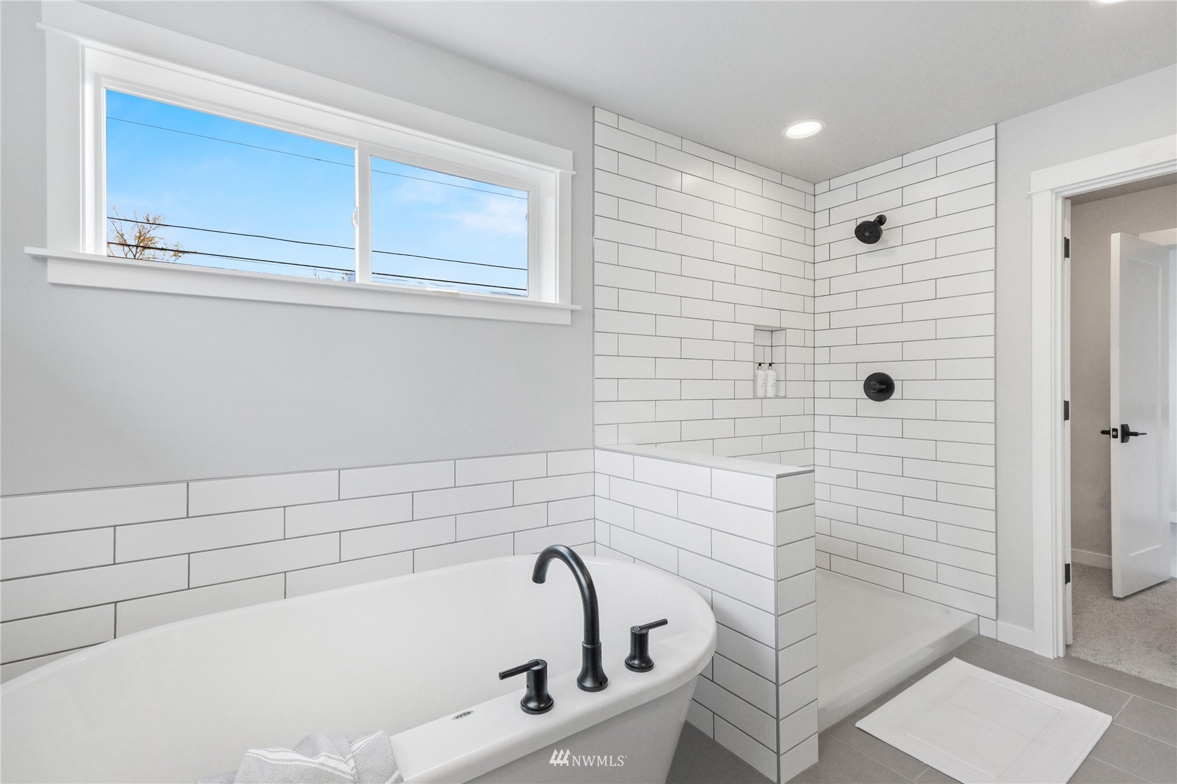 1305 197th Place Southeast Bothell, WA 98012 - Photo 22 of 33 a bathroom with a bathtub and shower