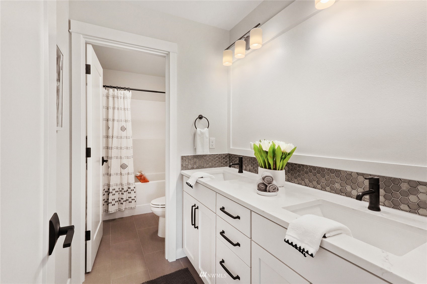 1305 197th Place Southeast Bothell, WA 98012 - Photo 25 of 33 a bathroom with a sink a vanity and a mirror