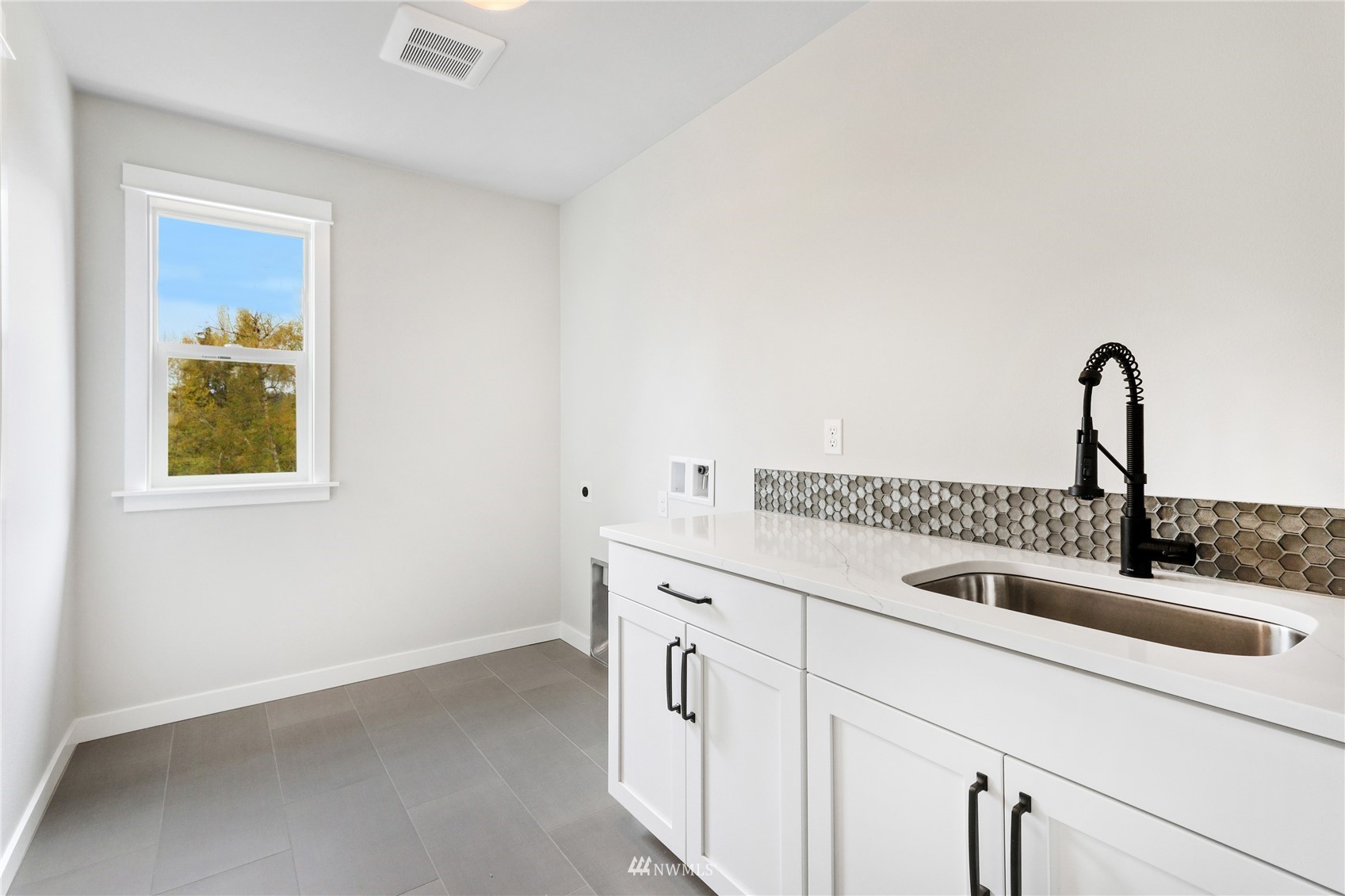 1305 197th Place Southeast Bothell, WA 98012 - Photo 27 of 33 a kitchen with a sink and cabinets