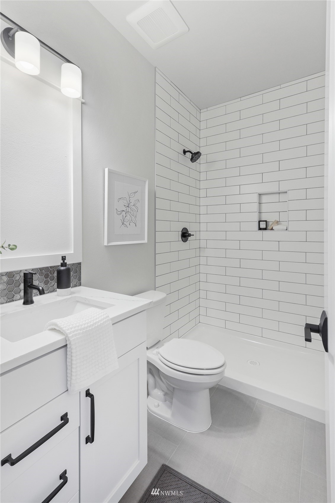 1305 197th Place Southeast Bothell, WA 98012 - Photo 29 of 33 a bathroom with a sink a toilet and shower