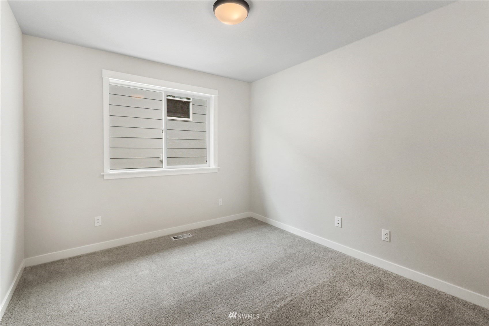 1305 197th Place Southeast Bothell, WA 98012 - Photo 30 of 33 an empty room with a window
