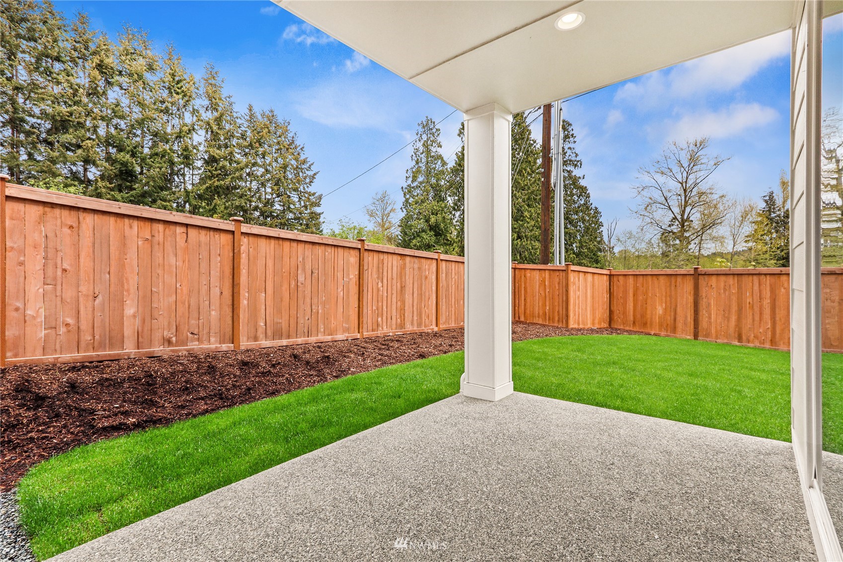 1305 197th Place Southeast Bothell, WA 98012 - Photo 31 of 33 a view of a backyard with wooden fence
