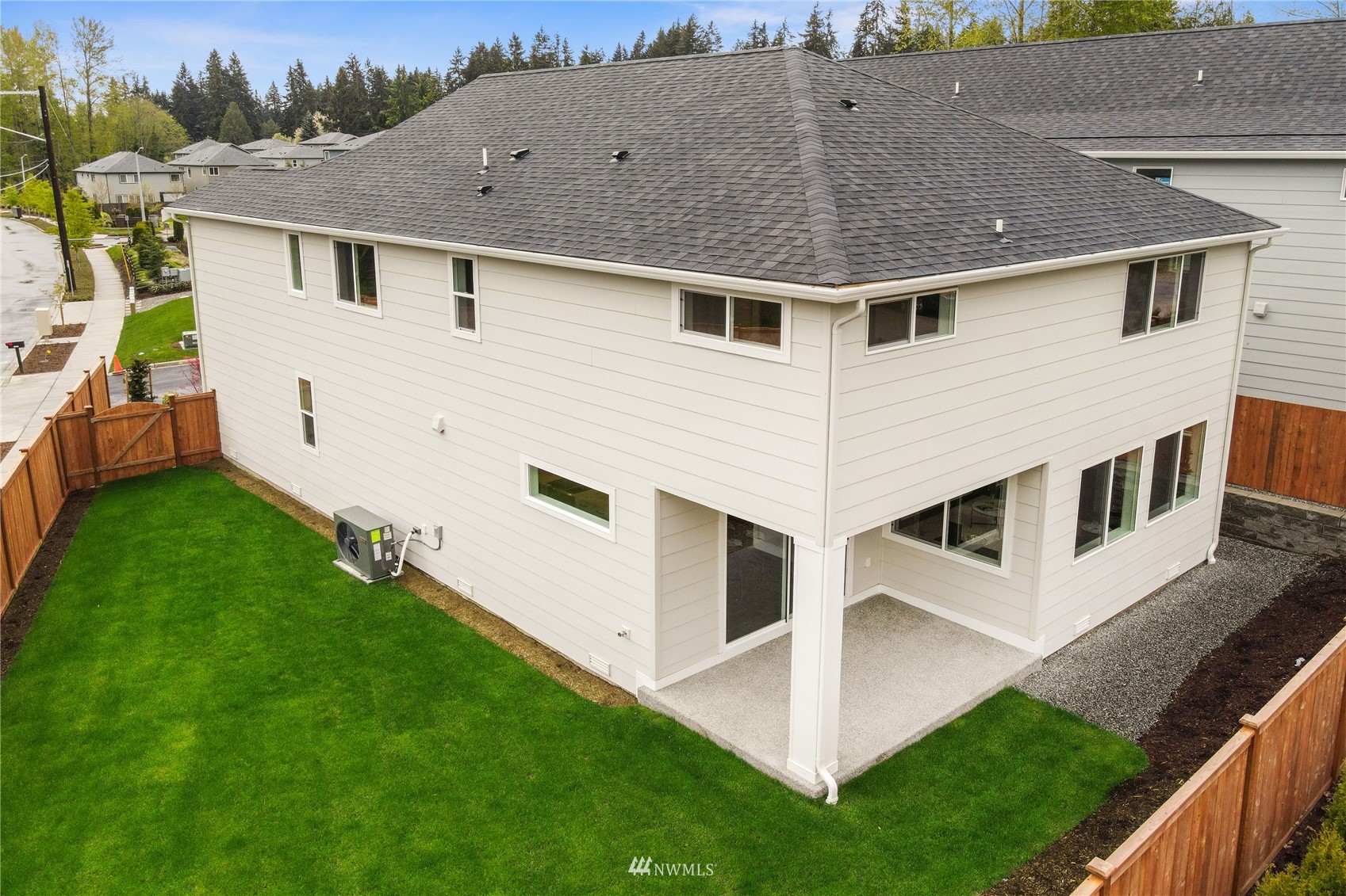 1305 197th Place Southeast Bothell, WA 98012 - Photo 33 of 33 a view of a white house next to a yard