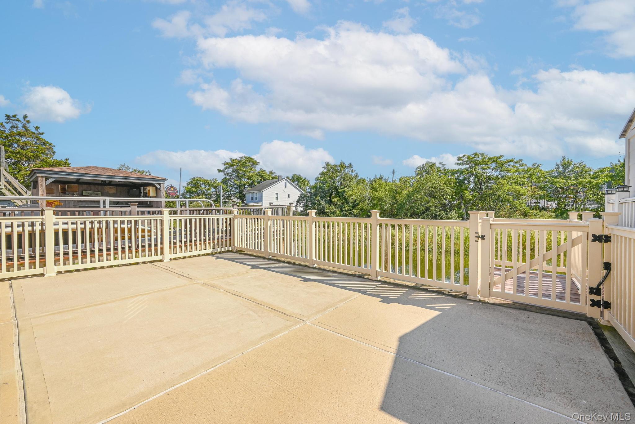20 West 18th Road Queens, NY 11693 - Photo 7 of 41 a view of a balcony with wooden floor