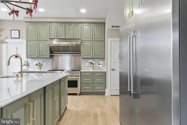 a view of staircase with railing and white walls