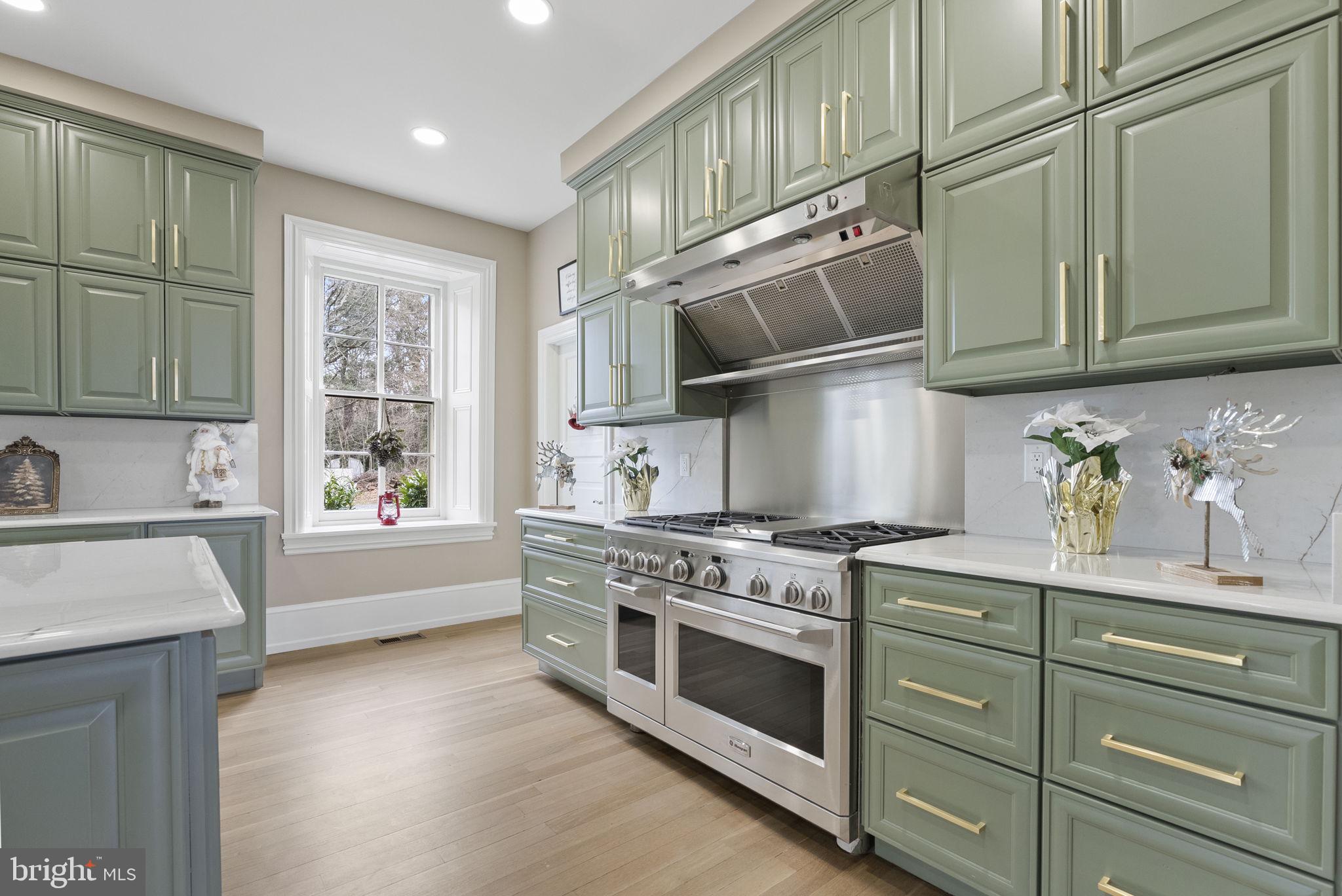 231 Woodlane Road Edgewater Park, NJ 08010 - Photo 19 of 95 a kitchen with stainless steel appliances granite countertop a stove and a sink