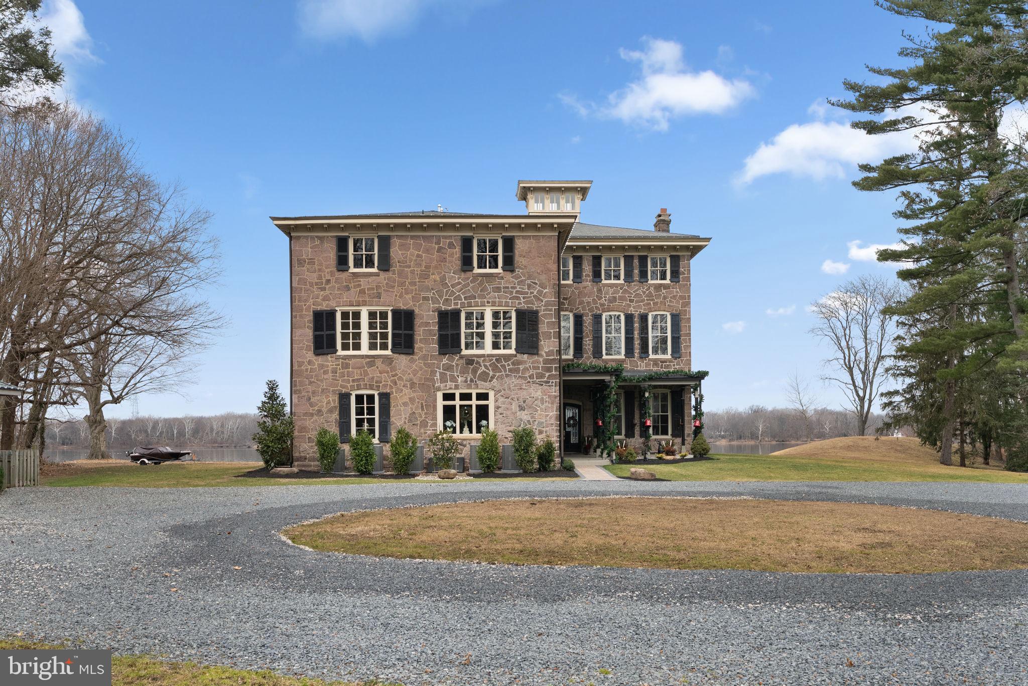 231 Woodlane Road Edgewater Park, NJ 08010 - Photo 2 of 95 a front view of a house with a yard and large trees
