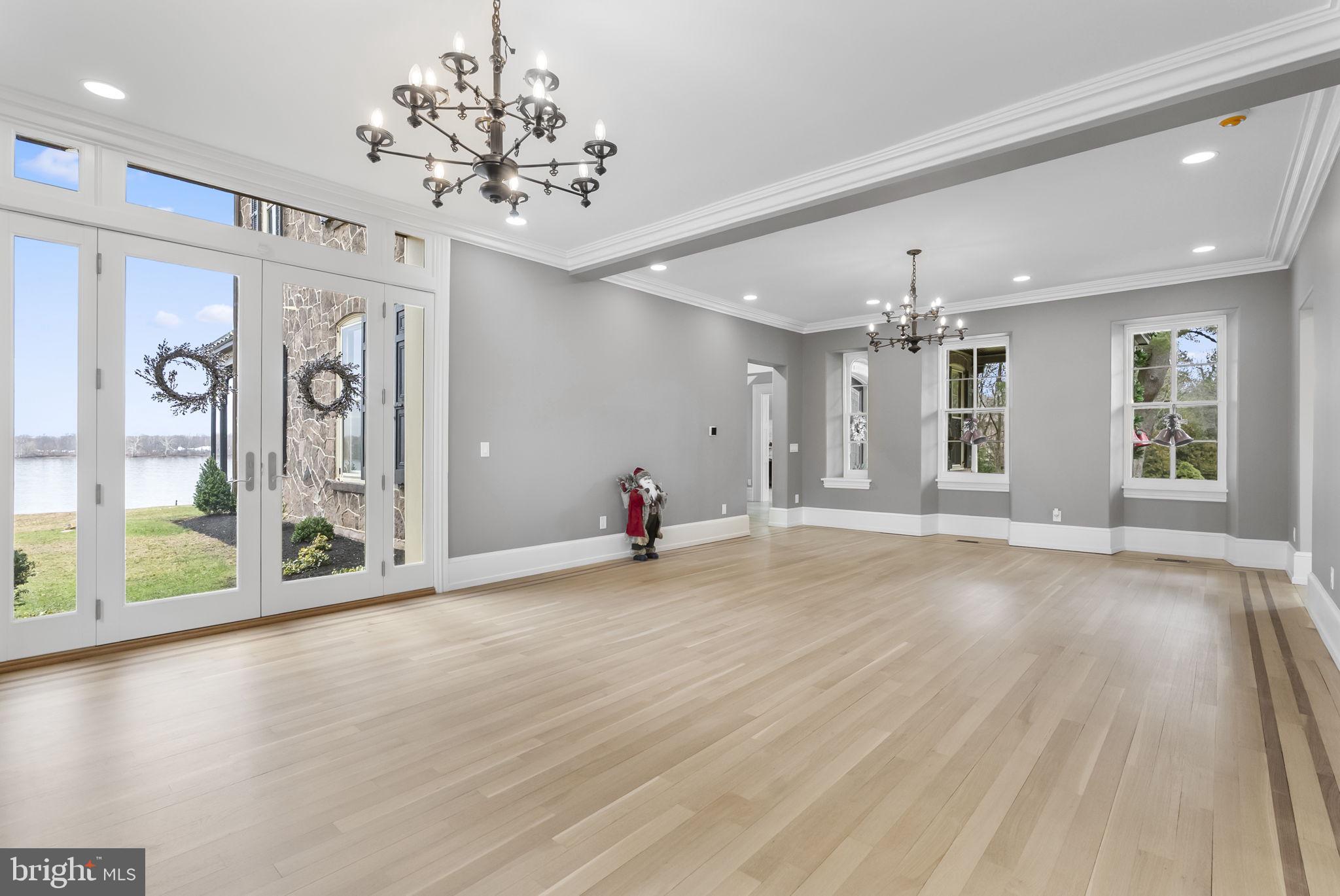 231 Woodlane Road Edgewater Park, NJ 08010 - Photo 23 of 95 an empty room with wooden floor and large windows