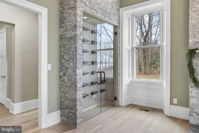 a bathroom with a sink mirror and shower