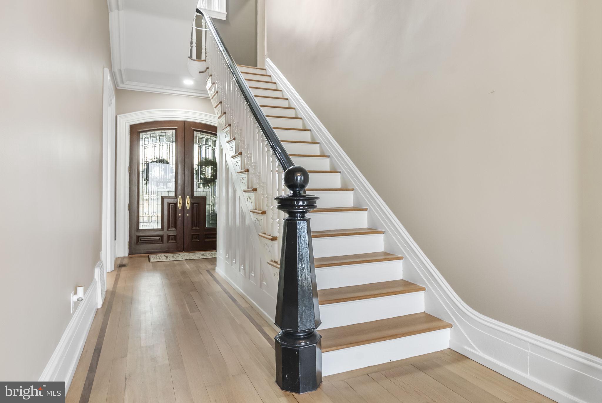 231 Woodlane Road Edgewater Park, NJ 08010 - Photo 38 of 95 a view of a hallway with wooden floor and entryway
