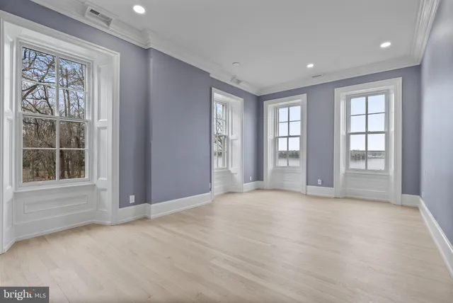 a view of entryway with wooden floor and stairs