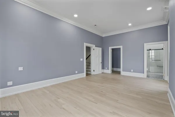 a view of entryway with wooden floor and stairs