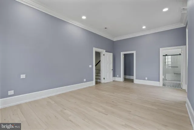 a view of entryway with wooden floor and stairs