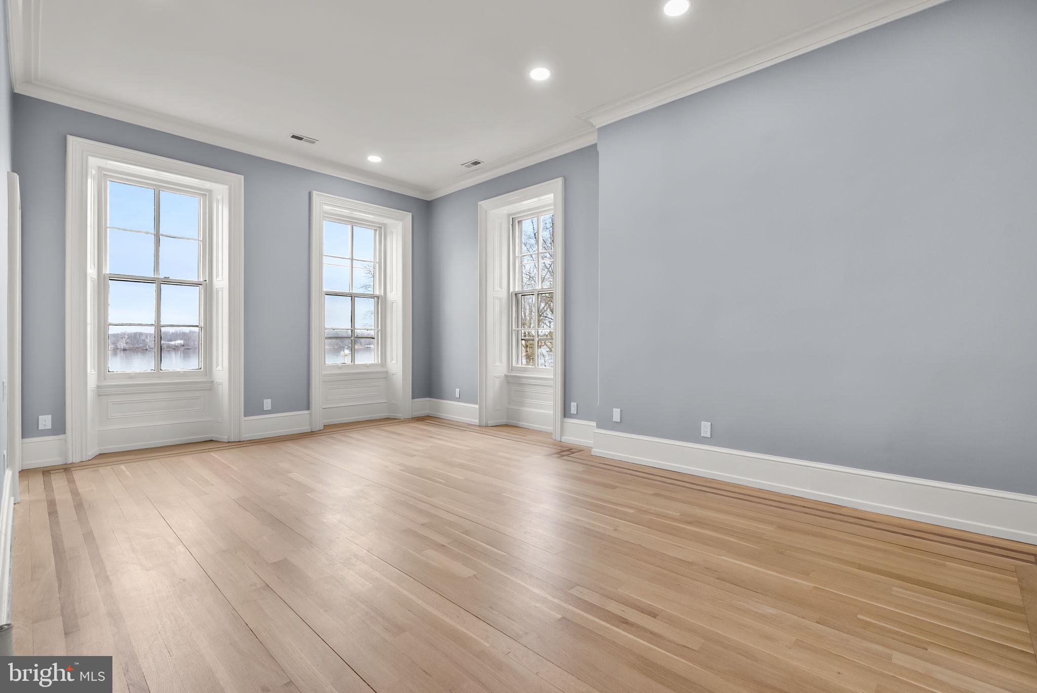 231 Woodlane Road Edgewater Park, NJ 08010 - Photo 45 of 95 a view of an empty room with wooden floor and windows