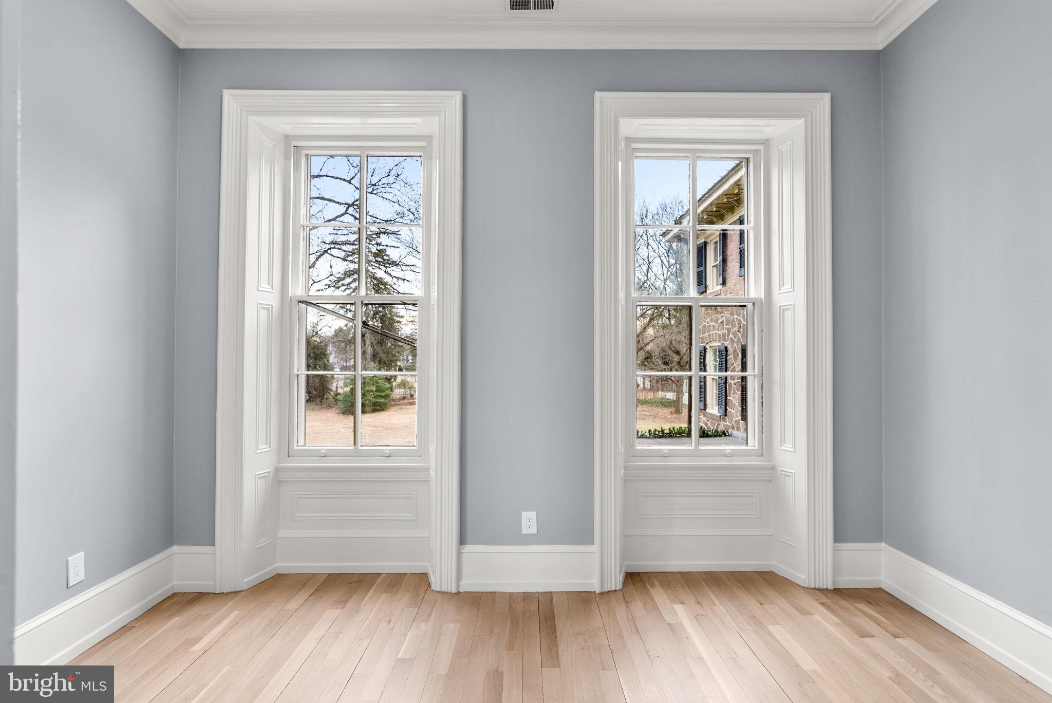 231 Woodlane Road Edgewater Park, NJ 08010 - Photo 51 of 95 an empty room with wooden floor and windows