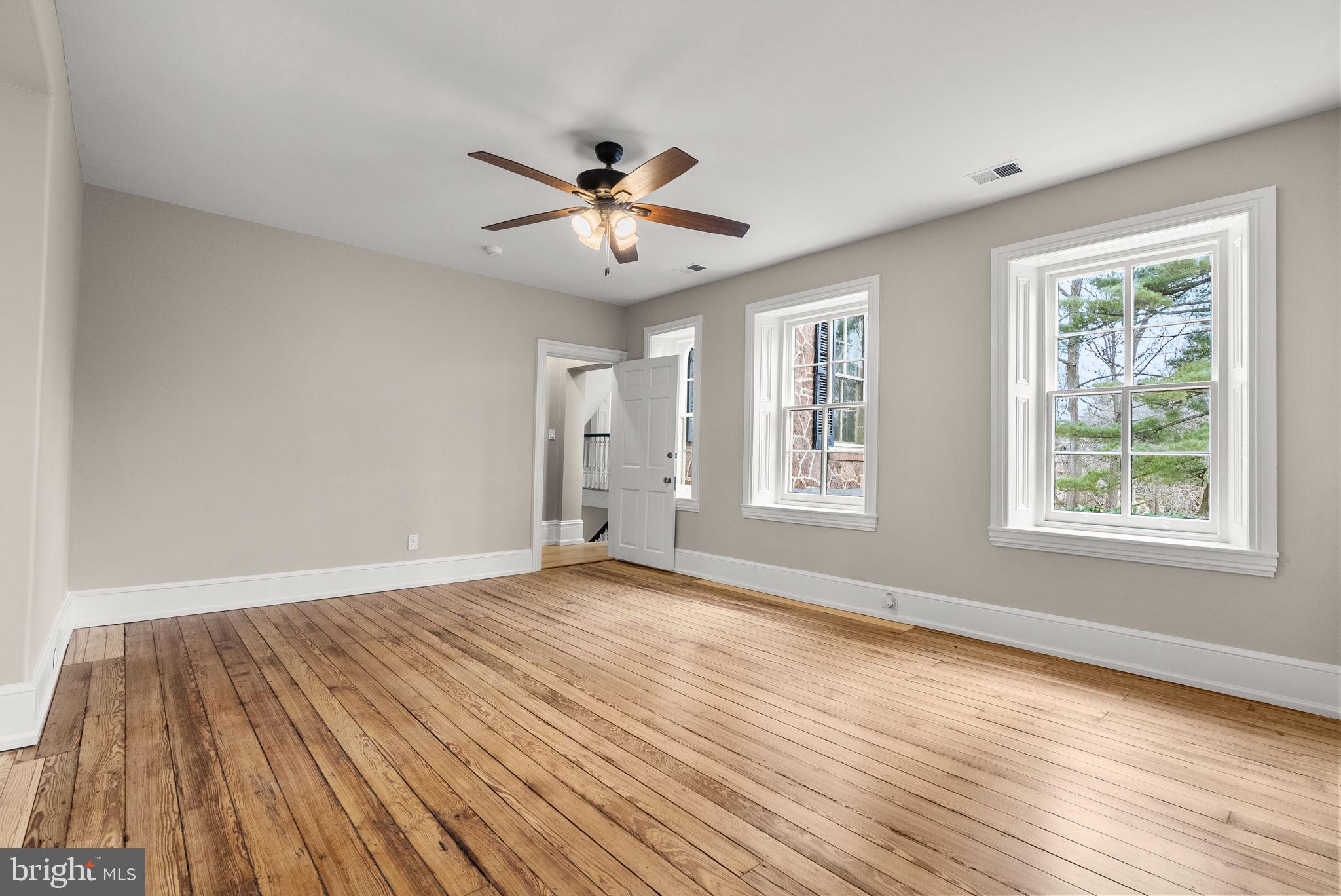 231 Woodlane Road Edgewater Park, NJ 08010 - Photo 54 of 95 a view of an empty room with wooden floor and a window
