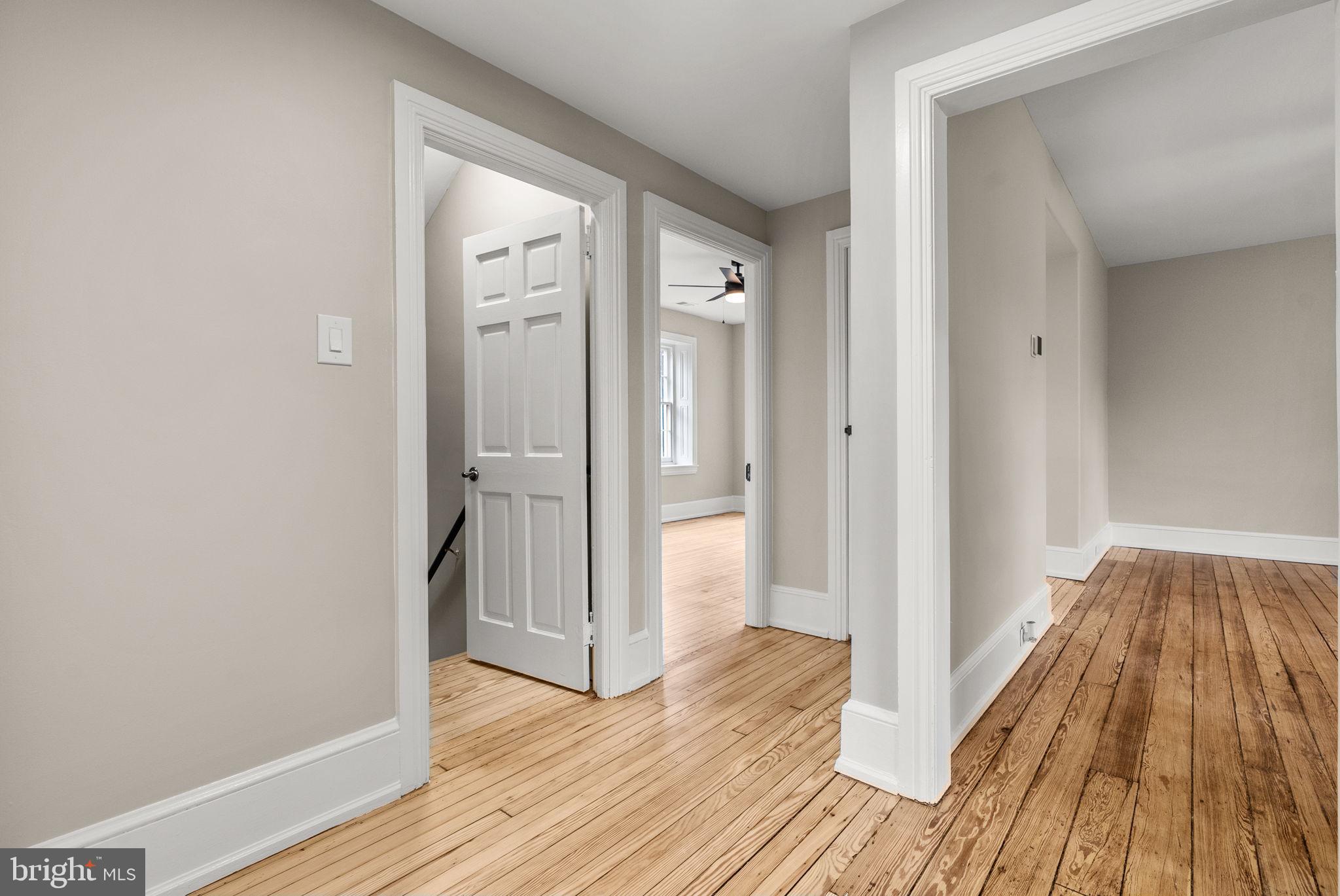 231 Woodlane Road Edgewater Park, NJ 08010 - Photo 58 of 95 a view of a hallway with wooden floor and closet