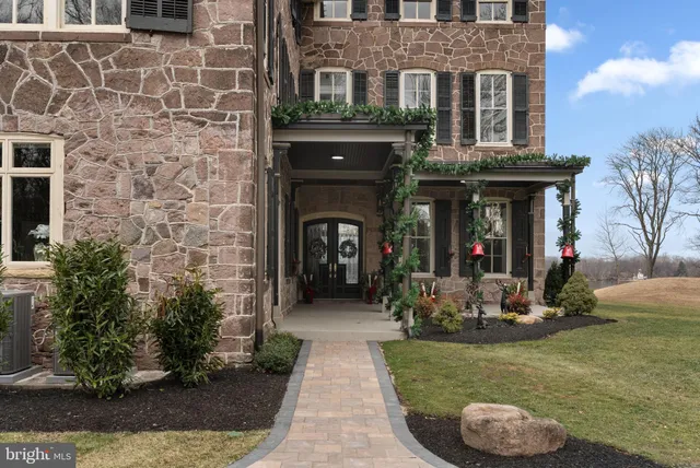 a kitchen with a sink cabinets and wooden floor