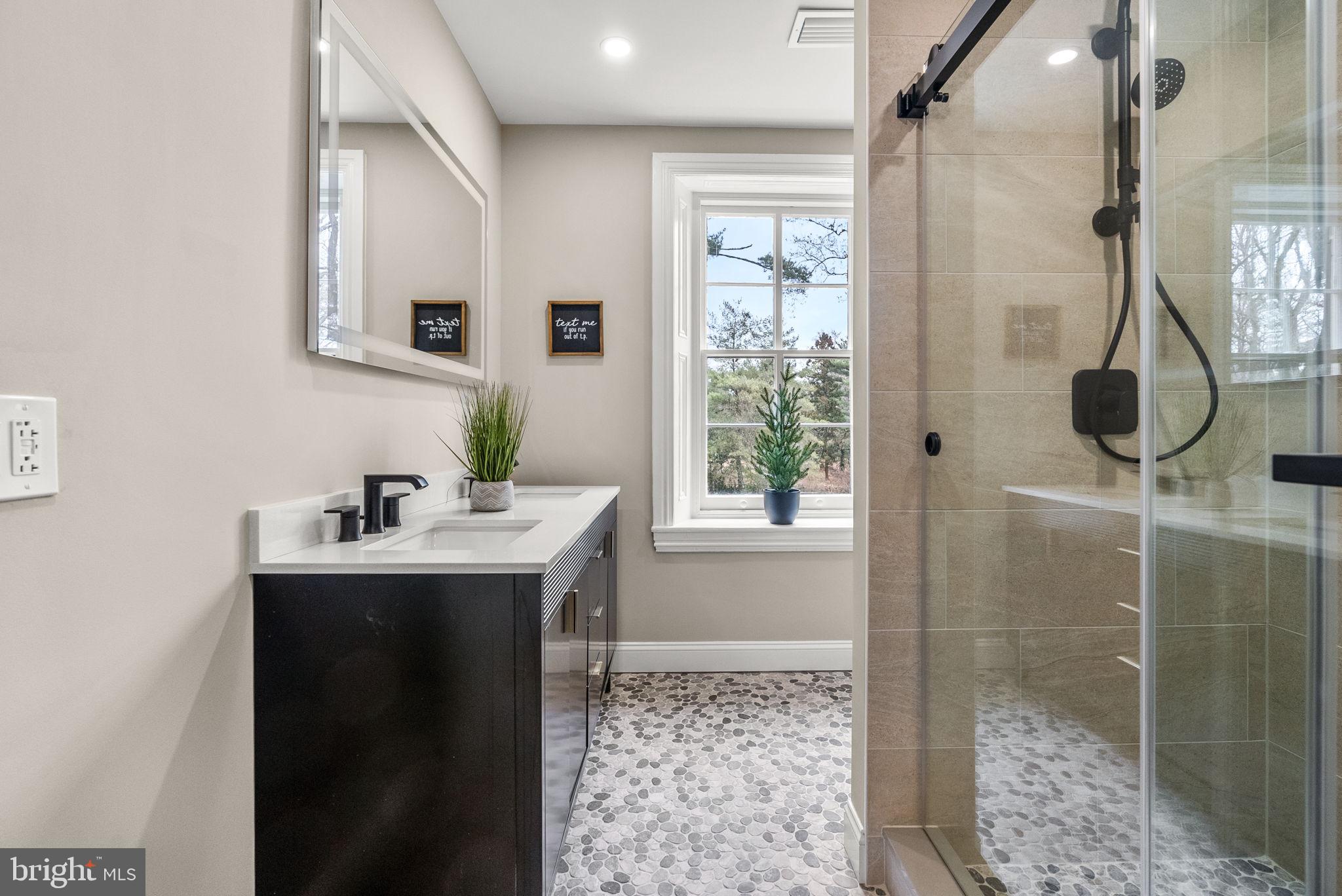 231 Woodlane Road Edgewater Park, NJ 08010 - Photo 62 of 95 a bathroom with a sink mirror and shower