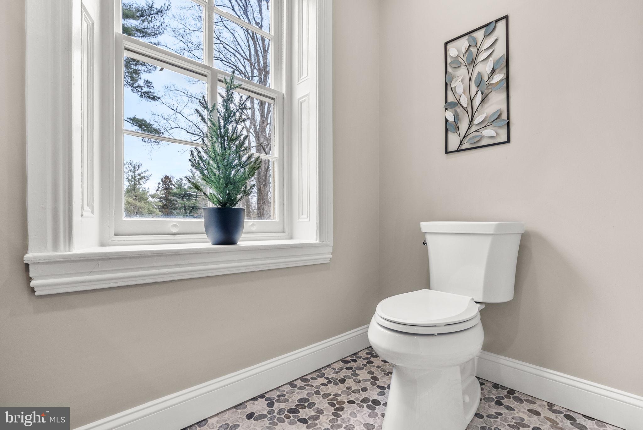 231 Woodlane Road Edgewater Park, NJ 08010 - Photo 63 of 95 a bathroom with a toilet and a window