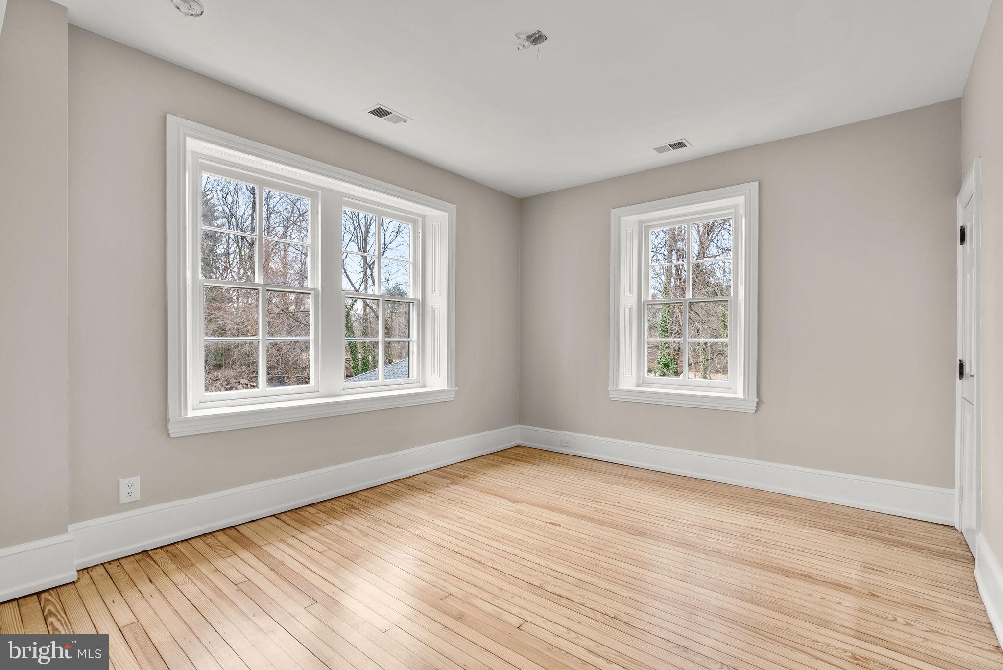 231 Woodlane Road Edgewater Park, NJ 08010 - Photo 64 of 95 a view of an empty room with wooden floor and a window