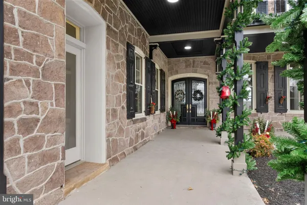 a kitchen with kitchen island granite countertop stainless steel appliances and cabinets