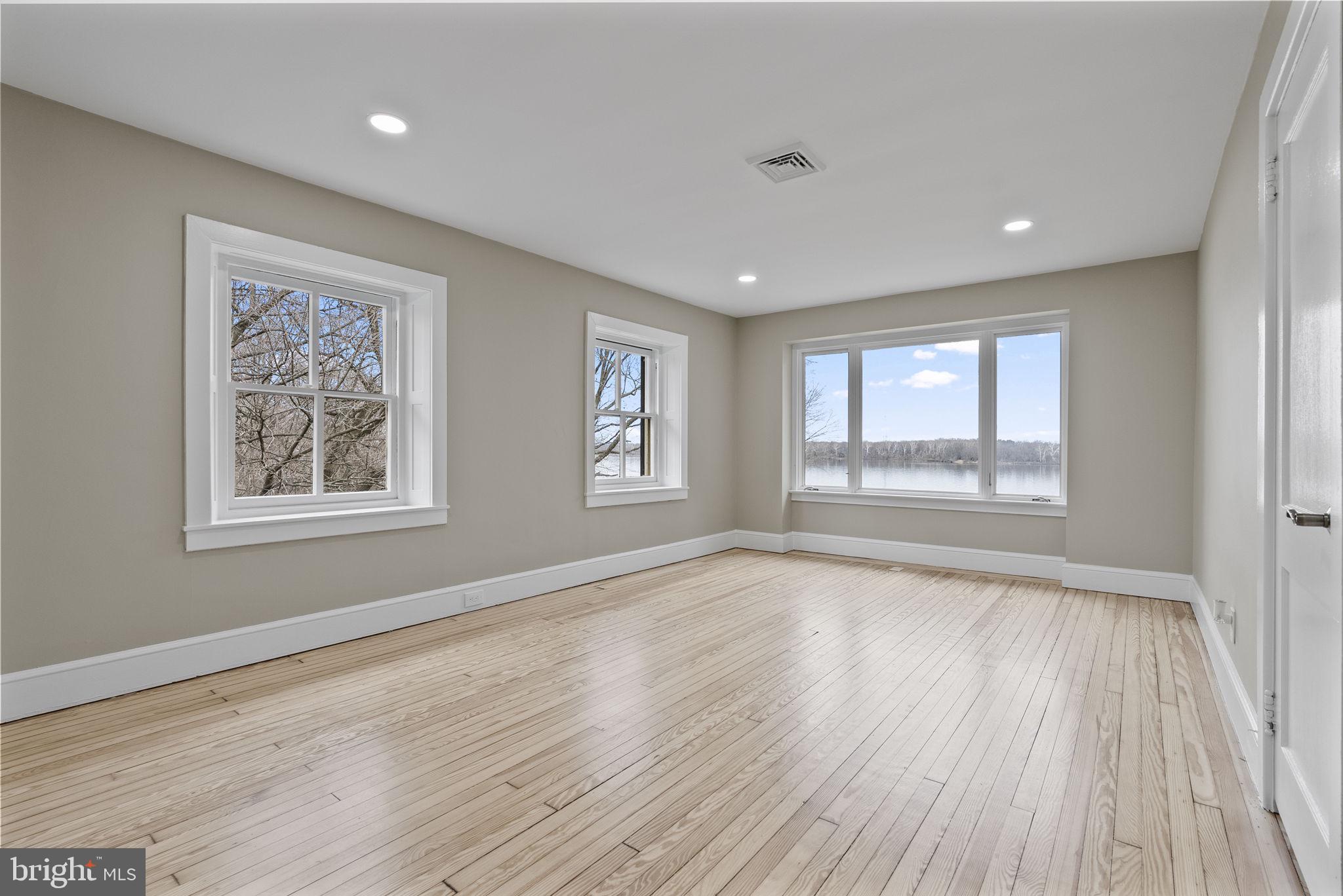 231 Woodlane Road Edgewater Park, NJ 08010 - Photo 74 of 95 a view of an empty room with wooden floor and a window