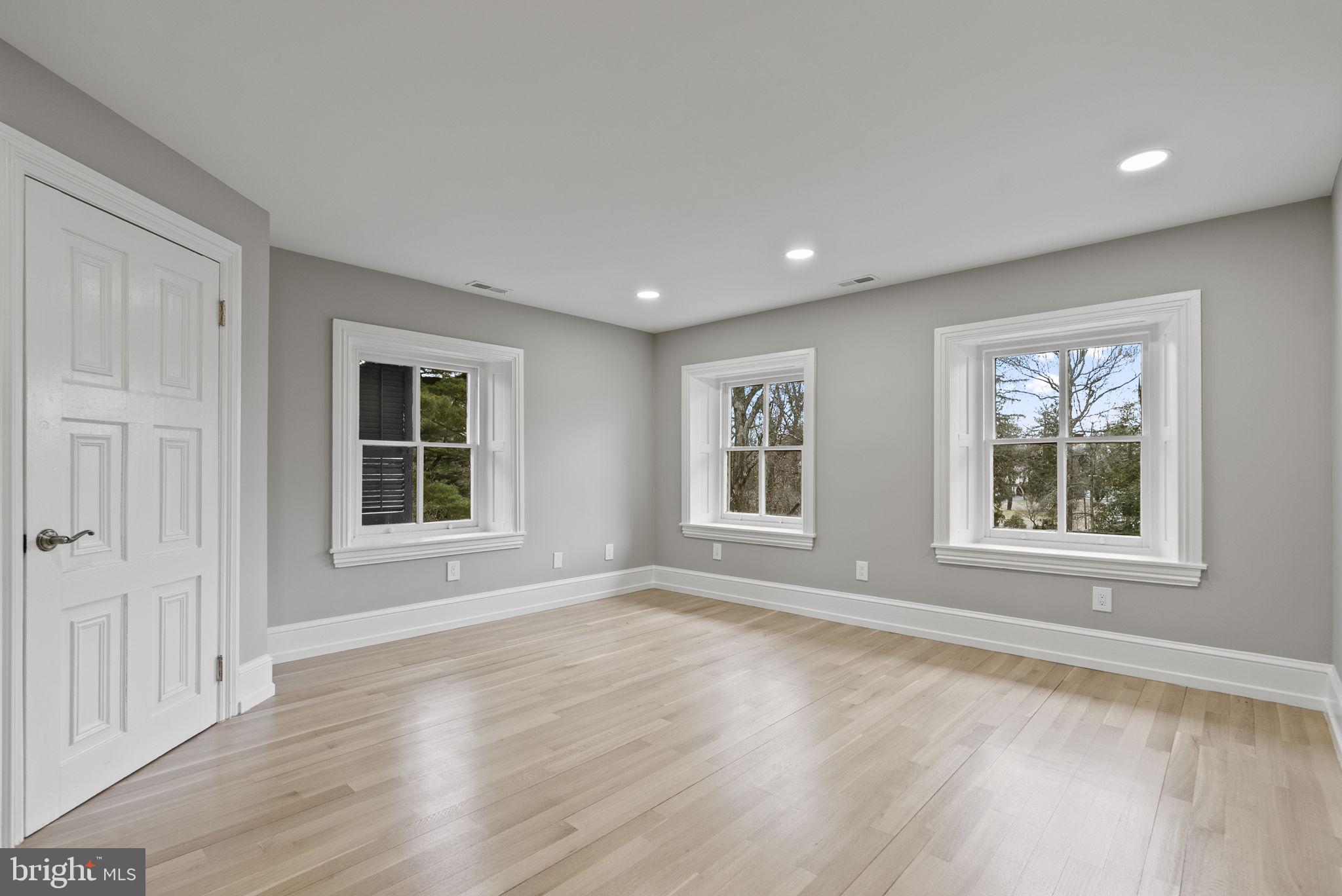 231 Woodlane Road Edgewater Park, NJ 08010 - Photo 78 of 95 an empty room with wooden floor and windows