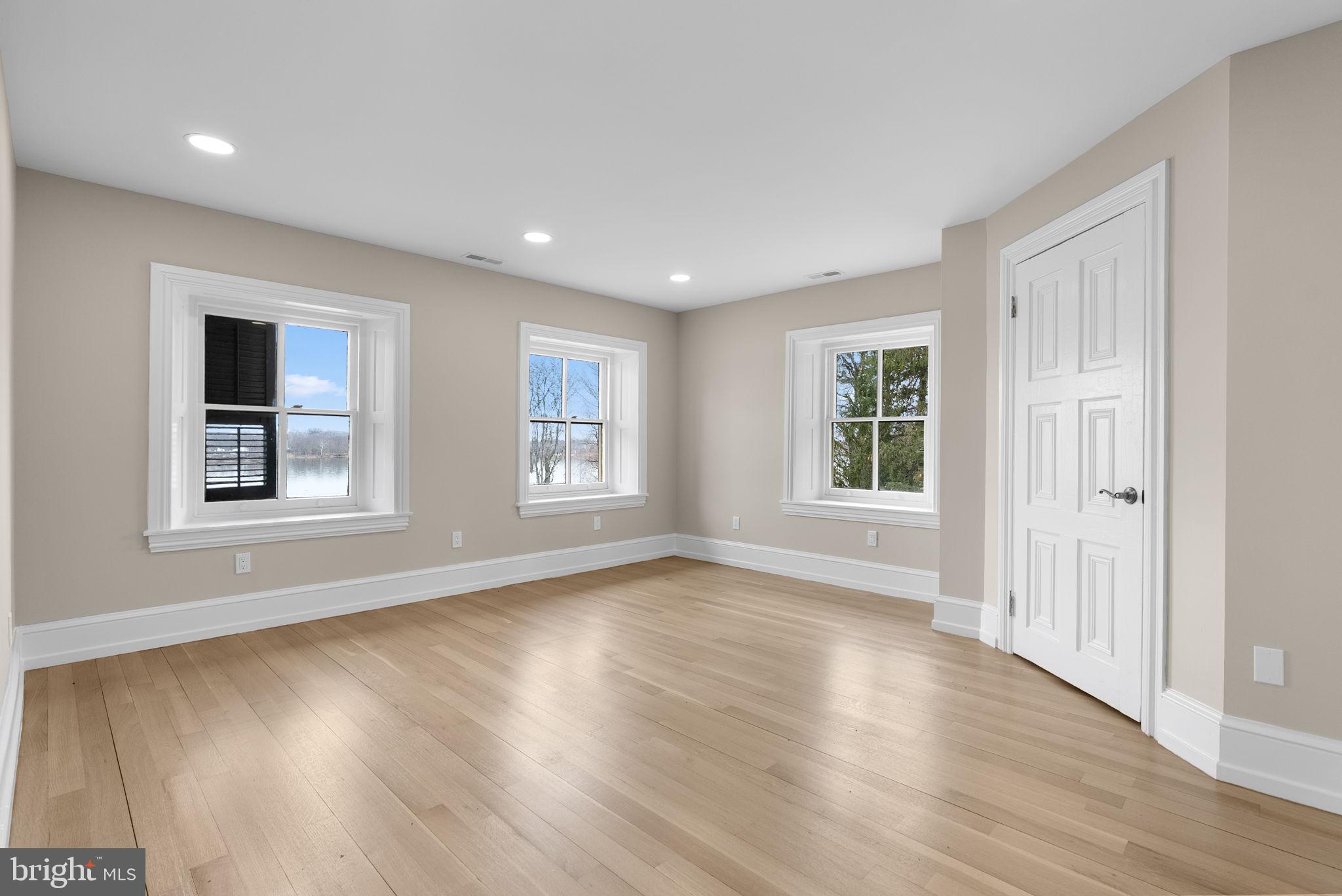 231 Woodlane Road Edgewater Park, NJ 08010 - Photo 79 of 95 a view of an empty room with wooden floor and a window