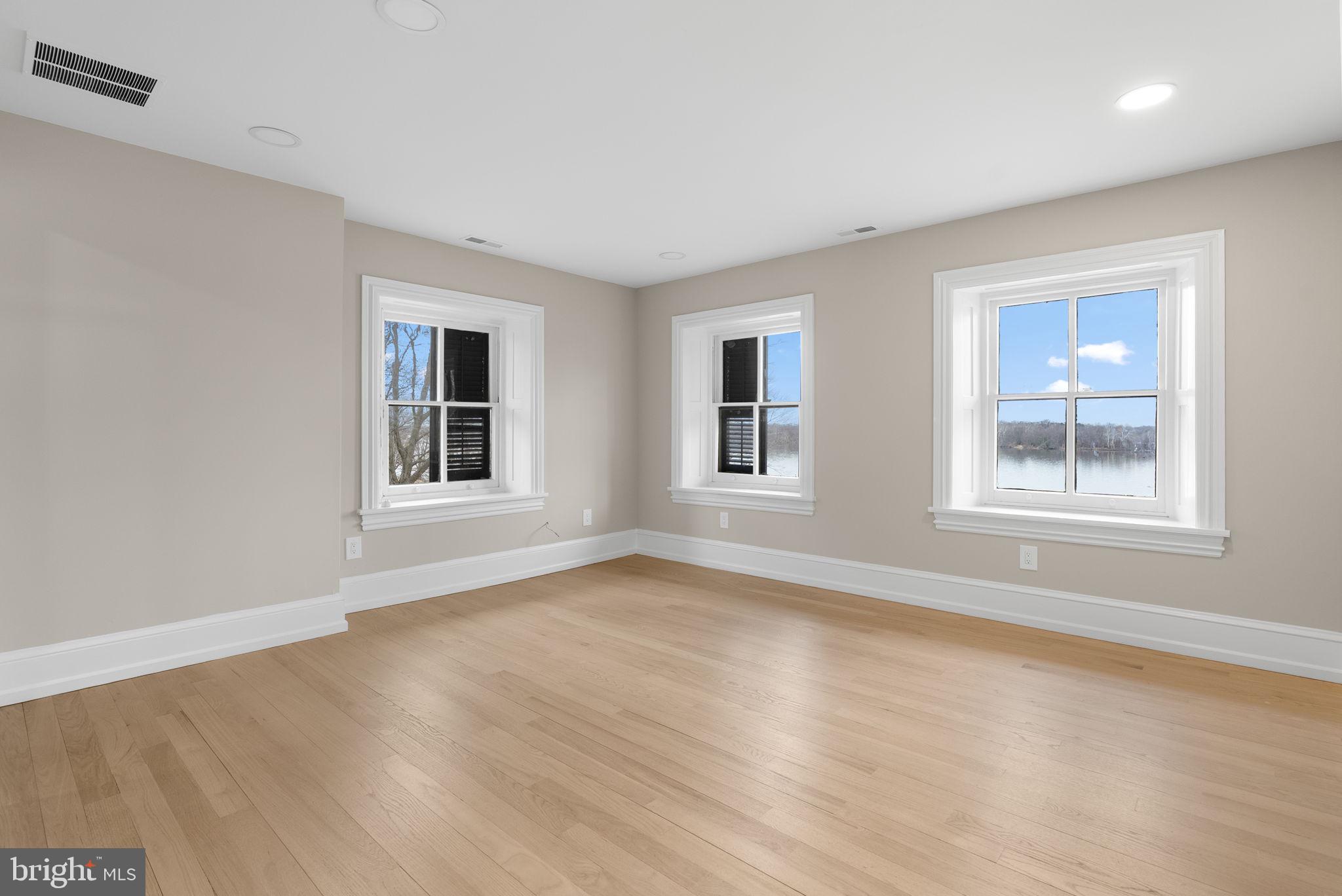 231 Woodlane Road Edgewater Park, NJ 08010 - Photo 80 of 95 a view of empty room with wooden floor and fan