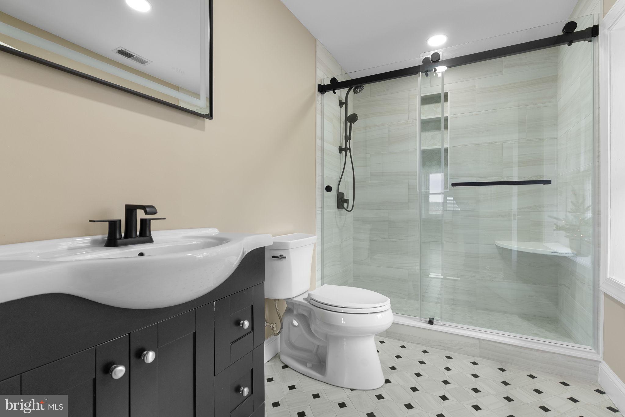 231 Woodlane Road Edgewater Park, NJ 08010 - Photo 81 of 95 a bathroom with a sink toilet a mirror and shower