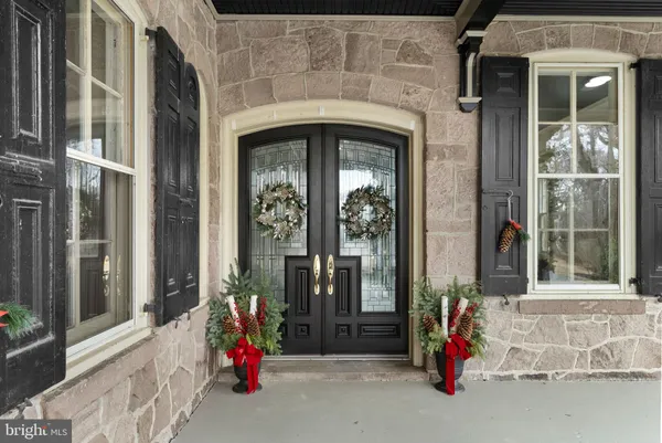 a kitchen with kitchen island stainless steel appliances a sink stove and refrigerator