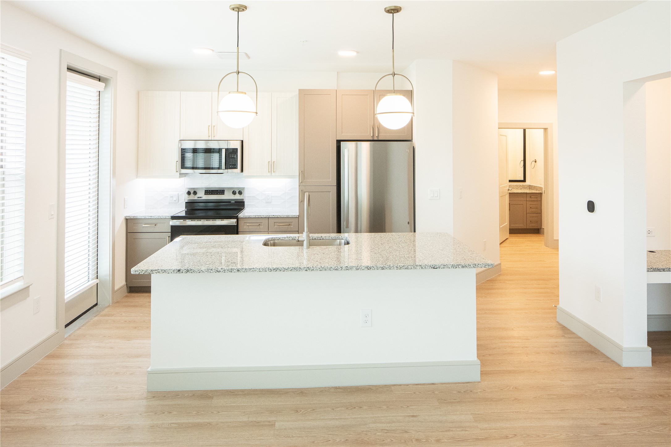 3100 Scofield Ridge Parkway, Unit 1403 Austin, TX 78727 - Photo 16 of 21 a view of kitchen island with stainless steel appliances granite countertop sink stove and refrigerator