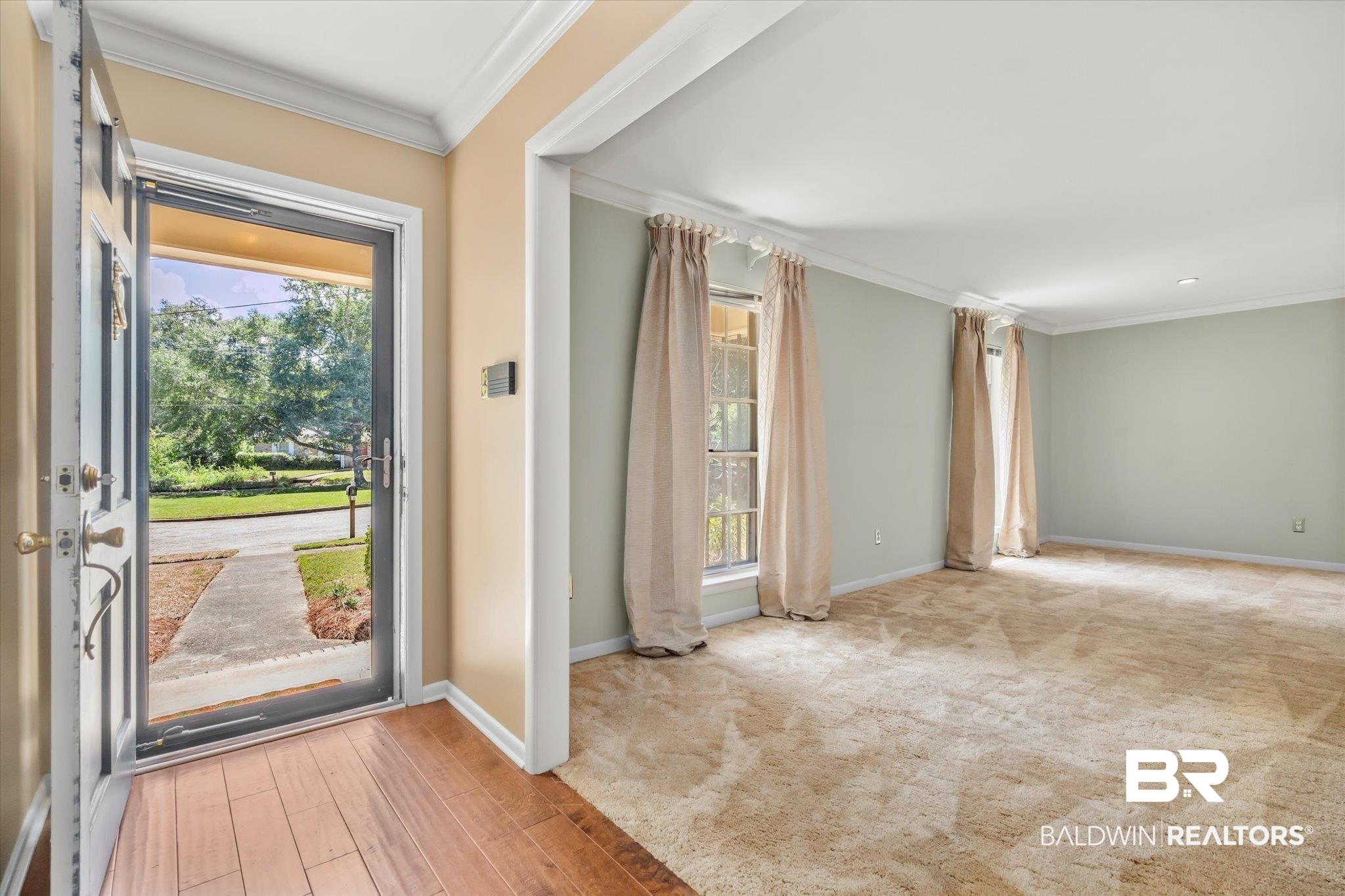 5608 Judson Circle Mobile, AL 36608 - Photo 2 of 20 Entryway with light wood-type flooring and crown molding