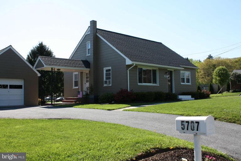 5707 Shookstown Road Frederick, MD 21702 - Photo 1 of 22 a front view of house with a garden and patio