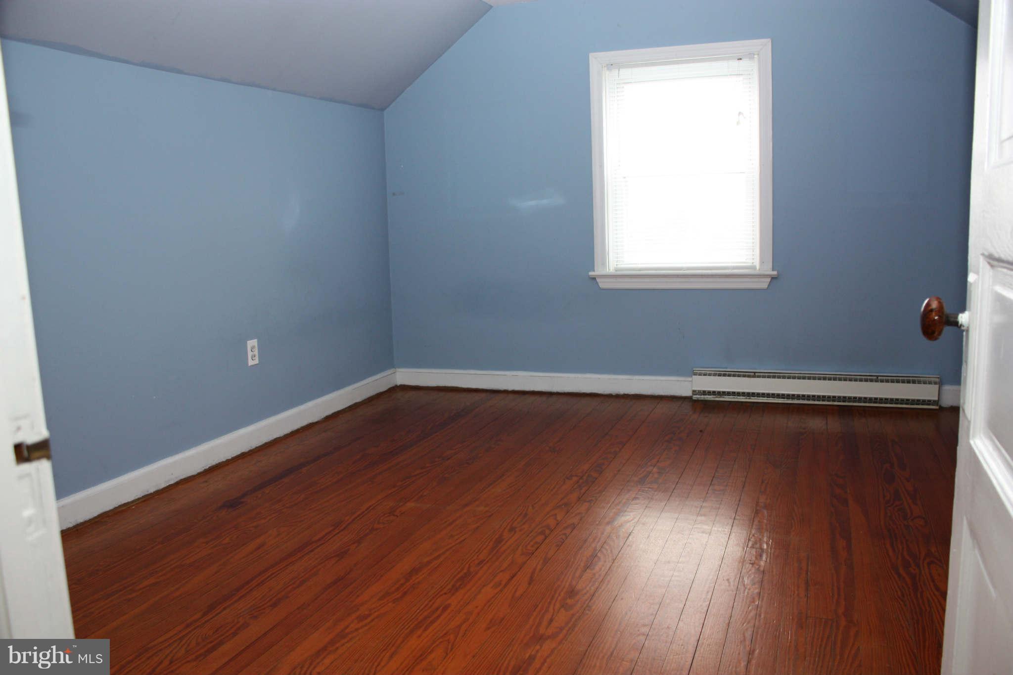 5707 Shookstown Road Frederick, MD 21702 - Photo 16 of 22 an empty room with wooden floor and windows