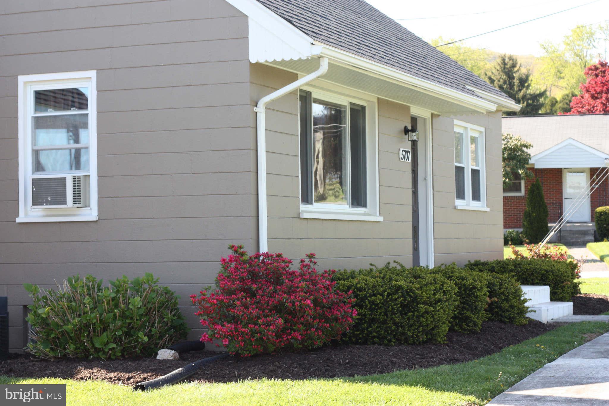 5707 Shookstown Road Frederick, MD 21702 - Photo 3 of 22 a front view of a house with a yard