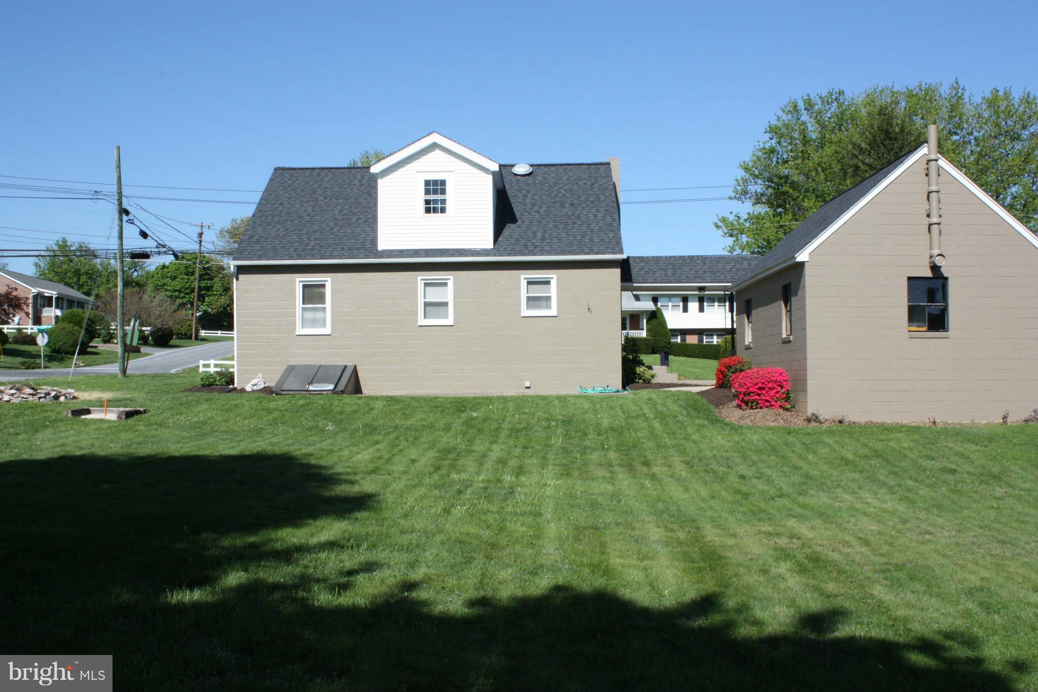 5707 Shookstown Road Frederick, MD 21702 - Photo 5 of 22 a front view of house with yard and trees