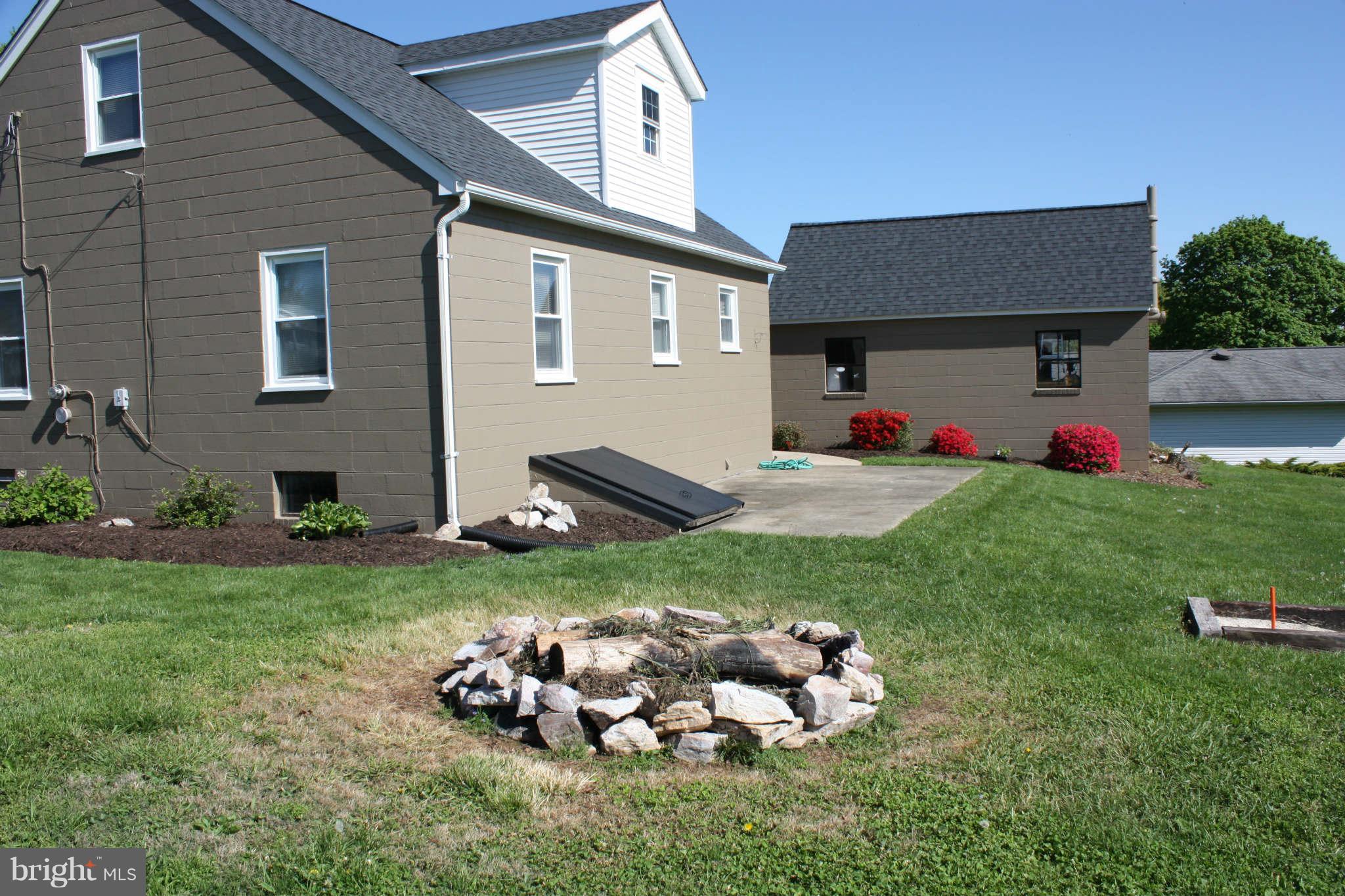 5707 Shookstown Road Frederick, MD 21702 - Photo 6 of 22 a front view of a house with garden