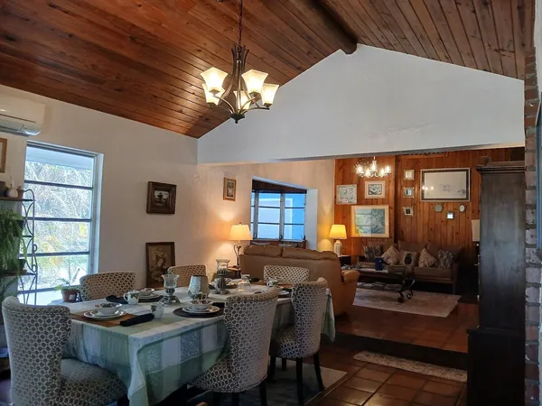 a dining room with furniture and window