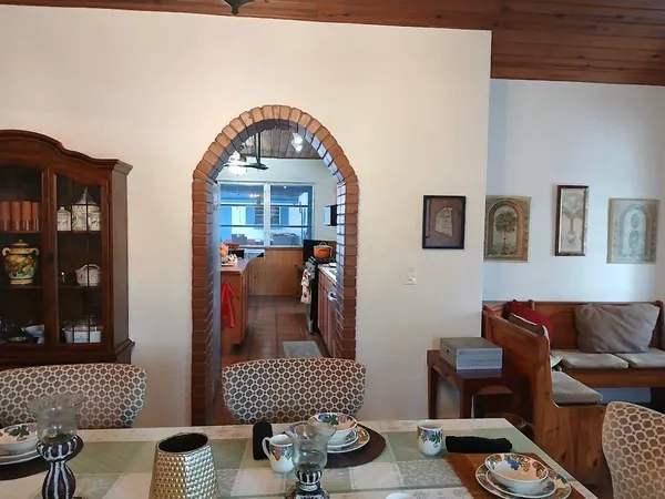 a kitchen with stainless steel appliances kitchen island granite countertop a sink stove and cabinets