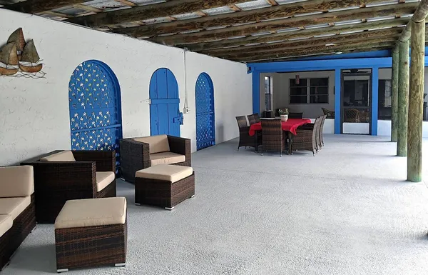 a living room with furniture rug and a window