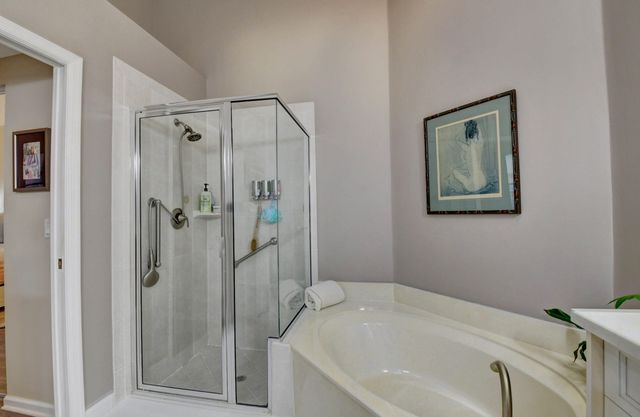 a bathroom with a tub and shower