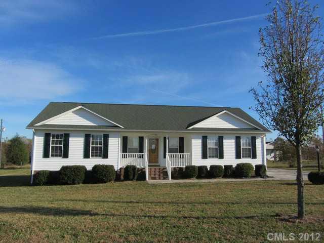 476 Owens Road York, SC 29745 - Photo 1 of 12 a front view of a house with a yard